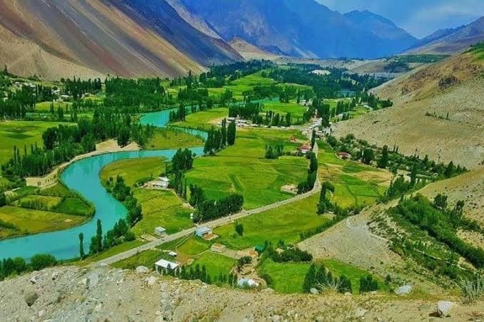 Wooden houses and green terraced fields in Kalash Valley, Chitral, Khyber Pakhtunkhwa